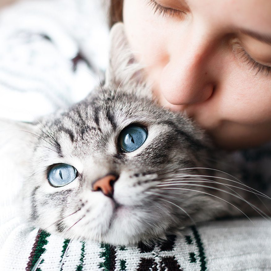 Woman Kissing Cat